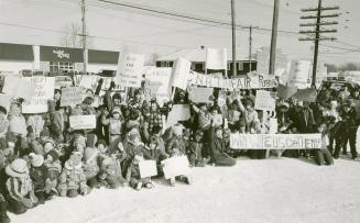 Nakina residents, young and old, gather outside the town's CN station to show they are against the planned move of 50 railway families to Hornepayne