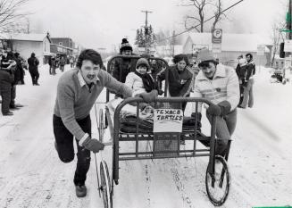 Colleen McLean, Chris McLean, Jay Logan, Paul McLean, and Doug Fleming are the Texaco Turtles, the open winners of Bocaygeon's bed races. Bobcaygeon, Ontario