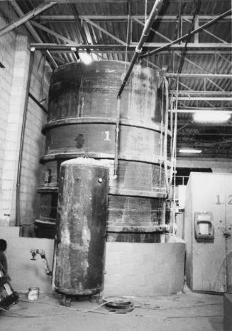 Large tank with dykes (concrete blocks) is the acid storage tank, toxic waste disposal plant. Bolton, Ontario