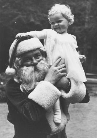Santa with child, Santa's Village, Bracebridge, Ontario