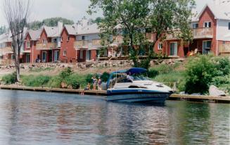 Shores of Muskoka Estates townhomes complex is on the river [Muskoka River?]. Bracebridge, Ontario