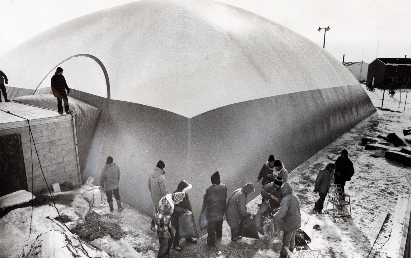A 100-foot-square plastic bubble inflated over a Balmoral Dr. pool. Bramalea, Ontario