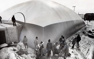 A 100-foot-square plastic bubble inflated over a Balmoral Dr. pool. Bramalea, Ontario