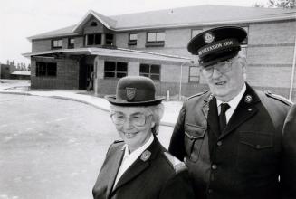 Family services worker of the Salvation Army, Lillian Kurtz and Brigadier Herb Honeychurch, in front of the new Peel Family Life Resource Centre. Brampton, Ontario