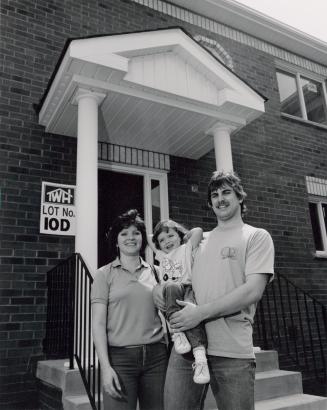 Kim and Sue Deon, with daughter Amanda, were one of the first-time buyers of a quattroplex townhome built by Town-Wood Homes. Brampton, Ontario