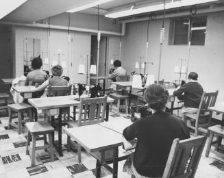 Inmates of the Ingleside [Ontario] Women's Guidance Centre learning to sew. Brampton, Ontario