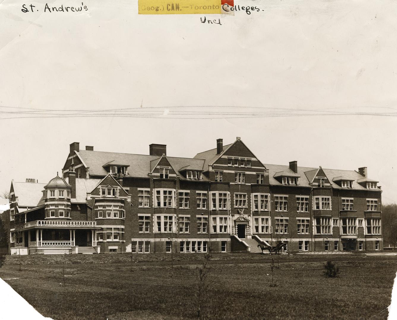 Image shows a four storey school building.