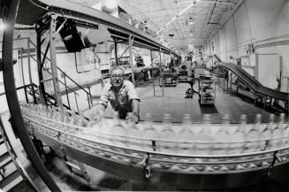 25-ounce bottles of rum being produced at the Bacardi Rum plant. Brampton, Ontario