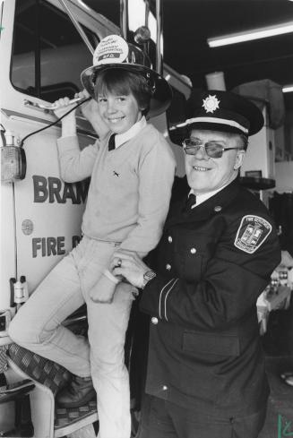 Poster boy Doug Cartwright and District Fire Chief Harry Newlove are both taking part in Brampton's Annual Muscular Dystrophy Telethon. Brampton, Ontario