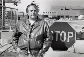 Lathe operator Guido Catello standing outside of the Massey Ferguson plant. Brantford, Ontario