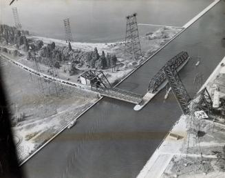 The Burlington Canal Lift Bridge bridge was opened to permit sailboats to pass through and caused record-breaking weekend traffic. Burlington, Ontario