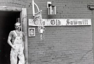 Tom Thekan outside his custom woodwork shop, the Old Sawmill. Campbellville, Ontario