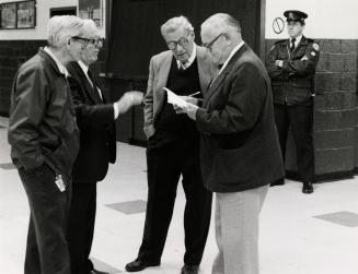 Arranging Ballard Funeral. Don McKenzie, right, building superintendent at Maple Leaf Gardens, talks to some senior employees about the funeral arrangements for Harold Ballard, who died yesterday at age 86. The funeral is to be a private affair.