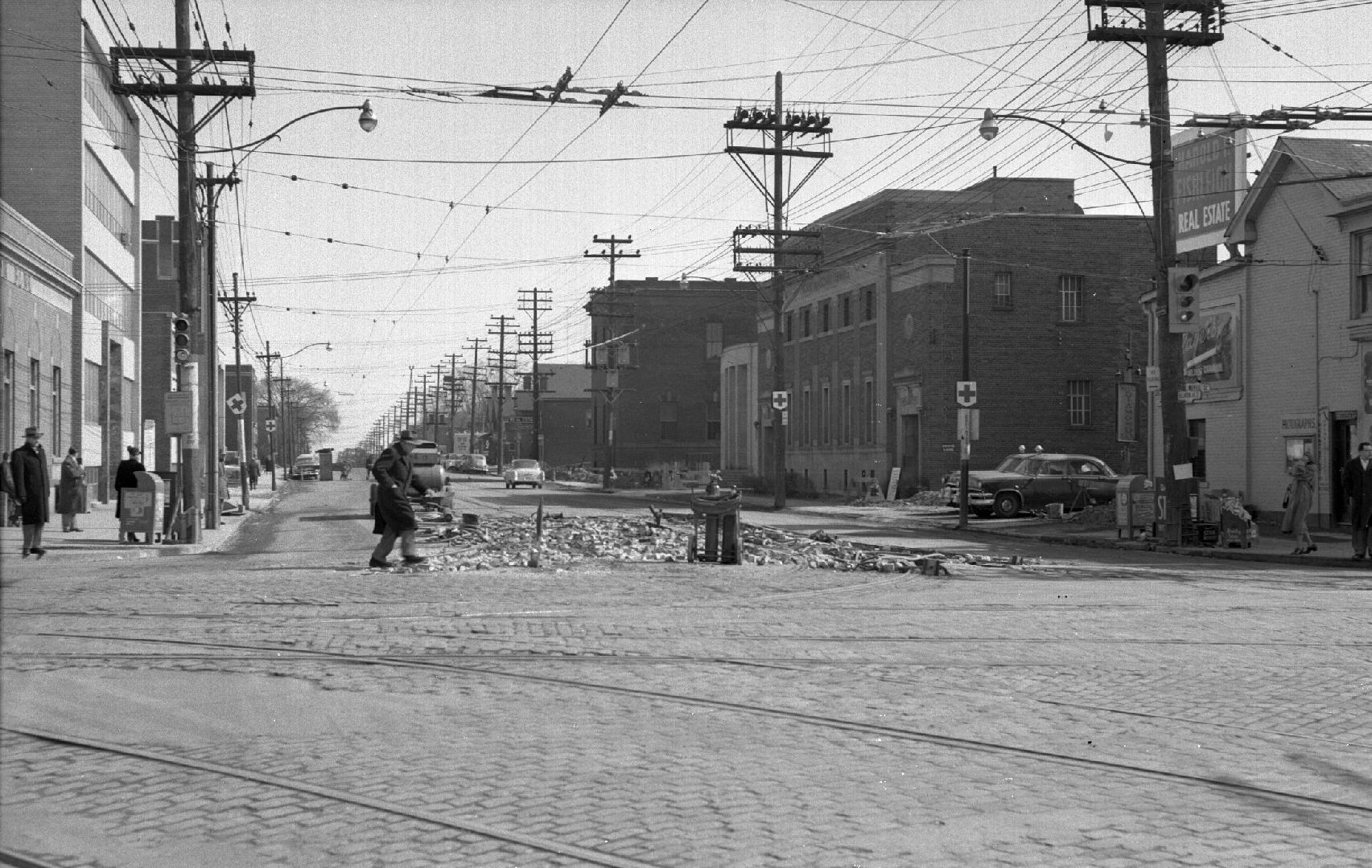 Eglinton Avenue East, looking e. from Yonge Street, showing removal of streetcar tracks, Toront ...