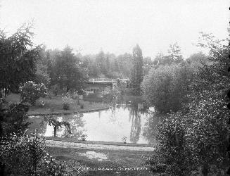 Historic photo from 1900 - View of a pond and bridge in Mount Pleasant Cemetery in Mount Pleasant Cemetery