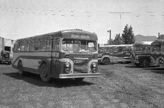 Hollinger Bus Lines, bus #62, at garage, Woodbine Avenue, southeast corner O'Connor Dr., looking east
