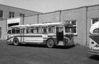 Hollinger Bus Lines, bus #92, at garage, Woodbine Avenue, southeast corner O'Connor Drive, looking northwest