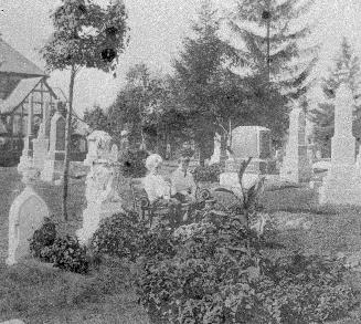 Historic photo from 1902 - Children sitting on a bench in Mount Pleasant Cemetery in Mount Pleasant Cemetery