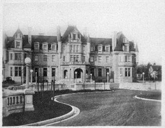 Image shows a three storey government house.