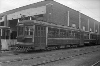 Image shows a rail car on tracks outdoors at Eglinton carhouse, Toronto, Ontario.