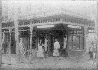 Historic photo from 1896 - Joseph W. Weston butcher shop, Carlton St., n.w. cor. Parliament St. w/ baby Ann Fern Weston in Cabbagetown