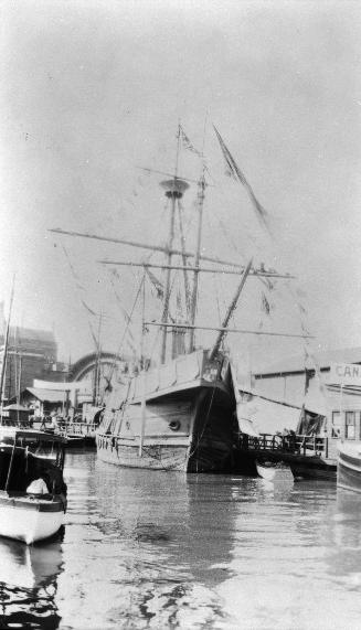Image shows a few boats docked.