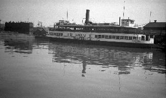 Image shows a ferry at the wharf.