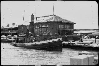 Image shows a tugboat at the terminal.