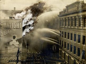 Historic photo from Tuesday, May 9, 1905 - Canadian Feather and Mattress Company fire, Melinda St., n. side, e. of Bay St. (Sunlight soap ad) in Financial District
