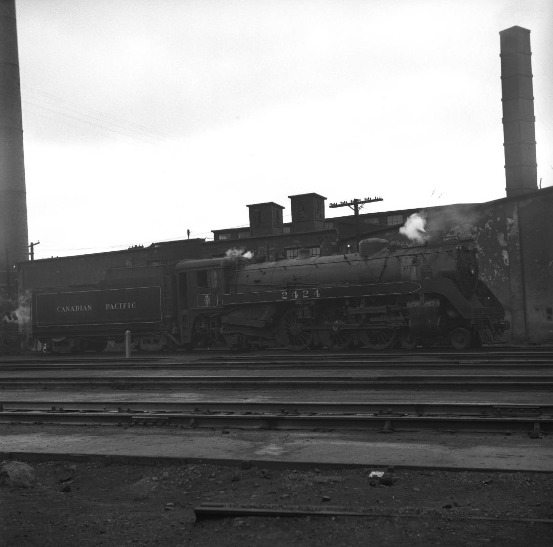 Locomotive and tender C. P. R., #2424, in C.P.R., Lambton Yards, St. Clair Avenue W., s.side between Runnymede Road & Jane St., Toronto, Ontario
