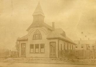 Historic photo from 1895 - Salvation Army Barracks with tower and peaked window in Dovercourt Park