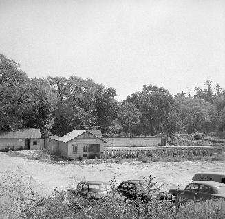 Historic photo from Tuesday, August 16, 1955 - York Mills Swimming Pool - closed after Hurricane Hazel, all signs removed, with Peter Pan truck in parking lot (east of Yonge St. at Mill St.) in Hoggs Hollow