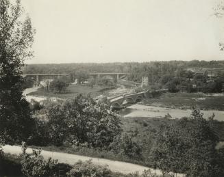 Old Mill Rd., looking west to bridge across Humber River between Catherine St. & Old Mill Rd., with Bloor St. bridge in background, taken from west end of Lessard Ave., showing Belt Line right-of-way in foreground, Toronto, Ontario