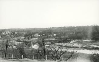 Old Mill Road., looking southwest to bridge (built 1916) across Humber River between Catherine St. & Old Mill Road., Bloor St. West bridge over Humber River in background, Toronto, Ontario