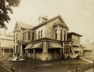 Historic photo from 1900 - Porch now enclosed - Culloden House with statue on the lawn (John Ross Robertson) in Cabbagetown South