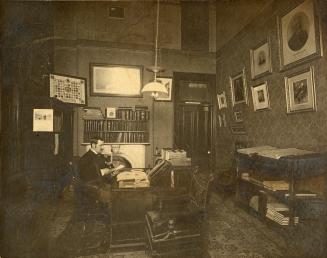 City Hall (1844-1899), Interior, City Treasurer's office, showing Richard T. Coady at his desk
