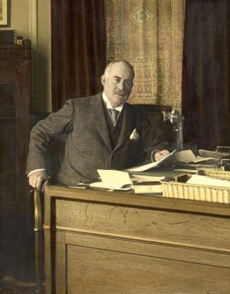 Hendrie, Sir John Strathearn, 1857-1923, at his desk in Government House