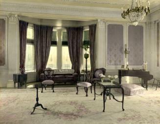 Image shows interior of the drawing room with a baby grand piano on the right.