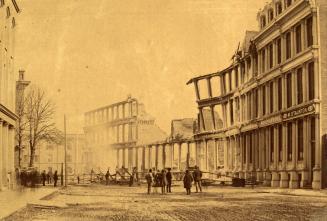 Historic photo from Thursday, February 15, 1872 - Iron Block on Front Street after the 1872 fire (was a cast-iron facade) in Downtown