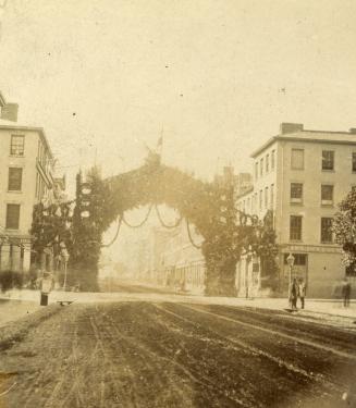 Historic photo from 1872 - Ornamental gate to celebrate the 1872 visit of the Marquess of Dufferin and Ava - King St. E., w. of Church St. in St. Lawrence