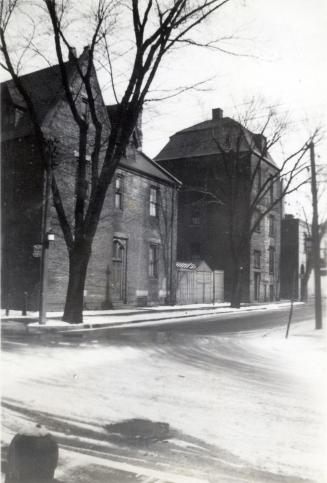 Historic photo from 1936 - Holy Trinity parsonage and the house of Henry Scadding Trinity Square , n. side, looking e. towards Yonge St in City Hall