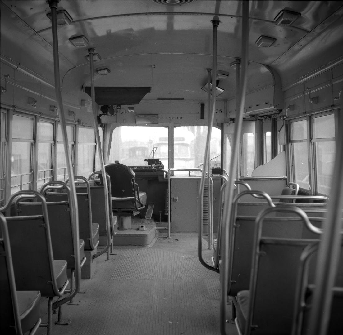 Image shows an interior of a rail car.

