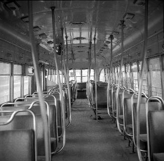 Image shows an interior of a rail car.