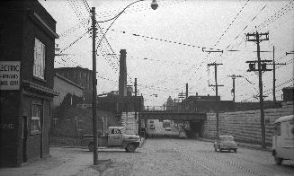 Keele St., looking south from north of Junction Road., showing C.P.R. bridge. Toronto, Ontario