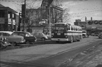 TTC bus #970, on Yonge Boulevard, looking southeast to Yonge Street, Toronto, Ontario. Image sh ...