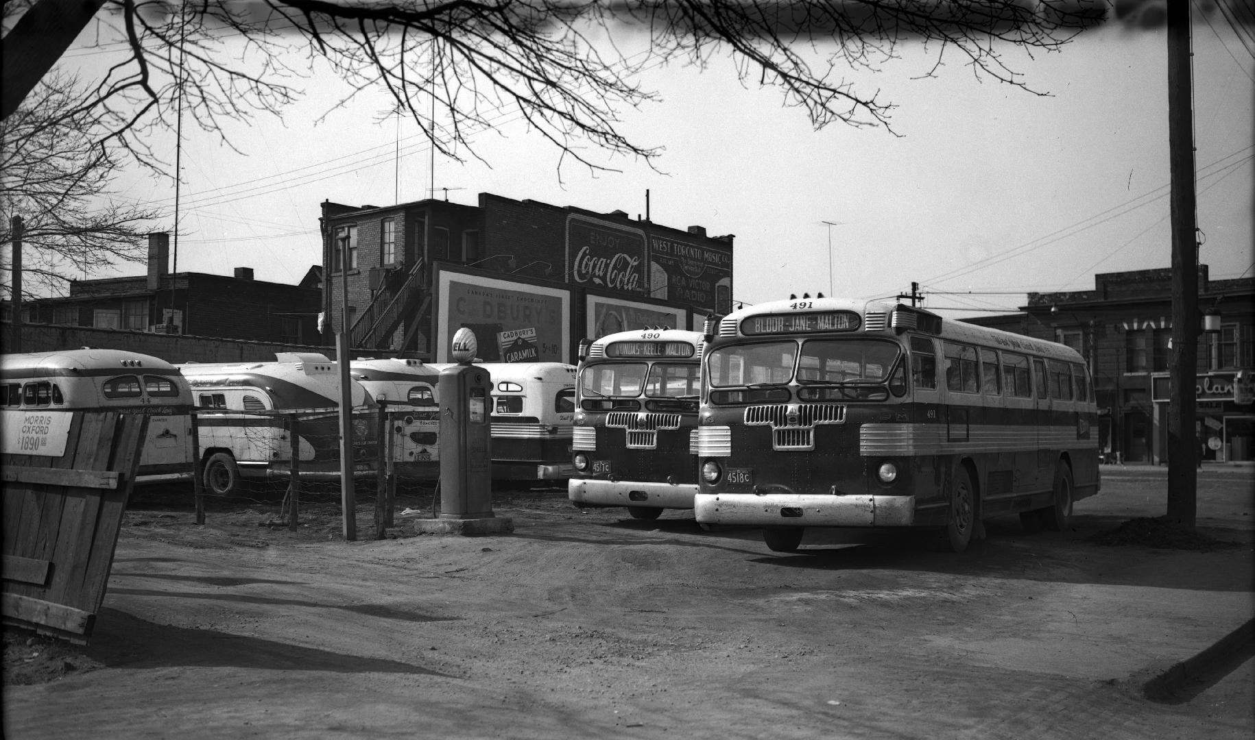 West York Coach Lines, garage [parking lot], Dundas Street West, southwest corner Pacific Avenue, looking north to Dundas St., showing, l. to r., buses #490 & #491 in foreground