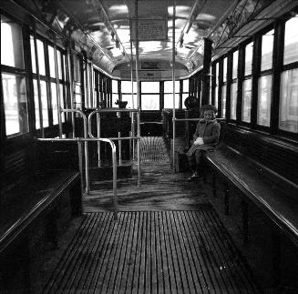  Image shows an interior of a rail car.
