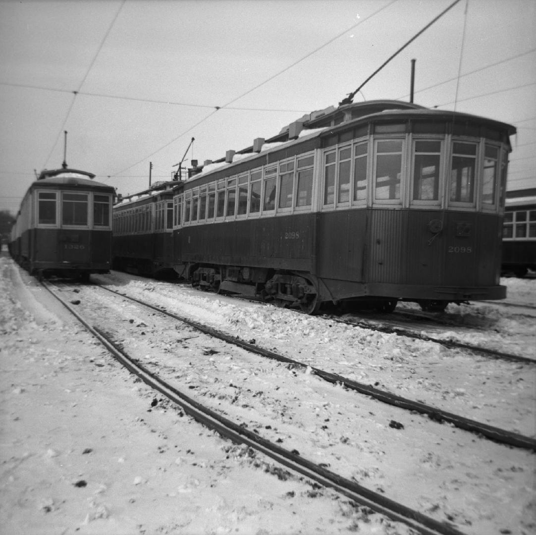 T.T.C., #2098 (at right) at Russell carhouse, Queen Street East, s .w. corner Connaught Avenue