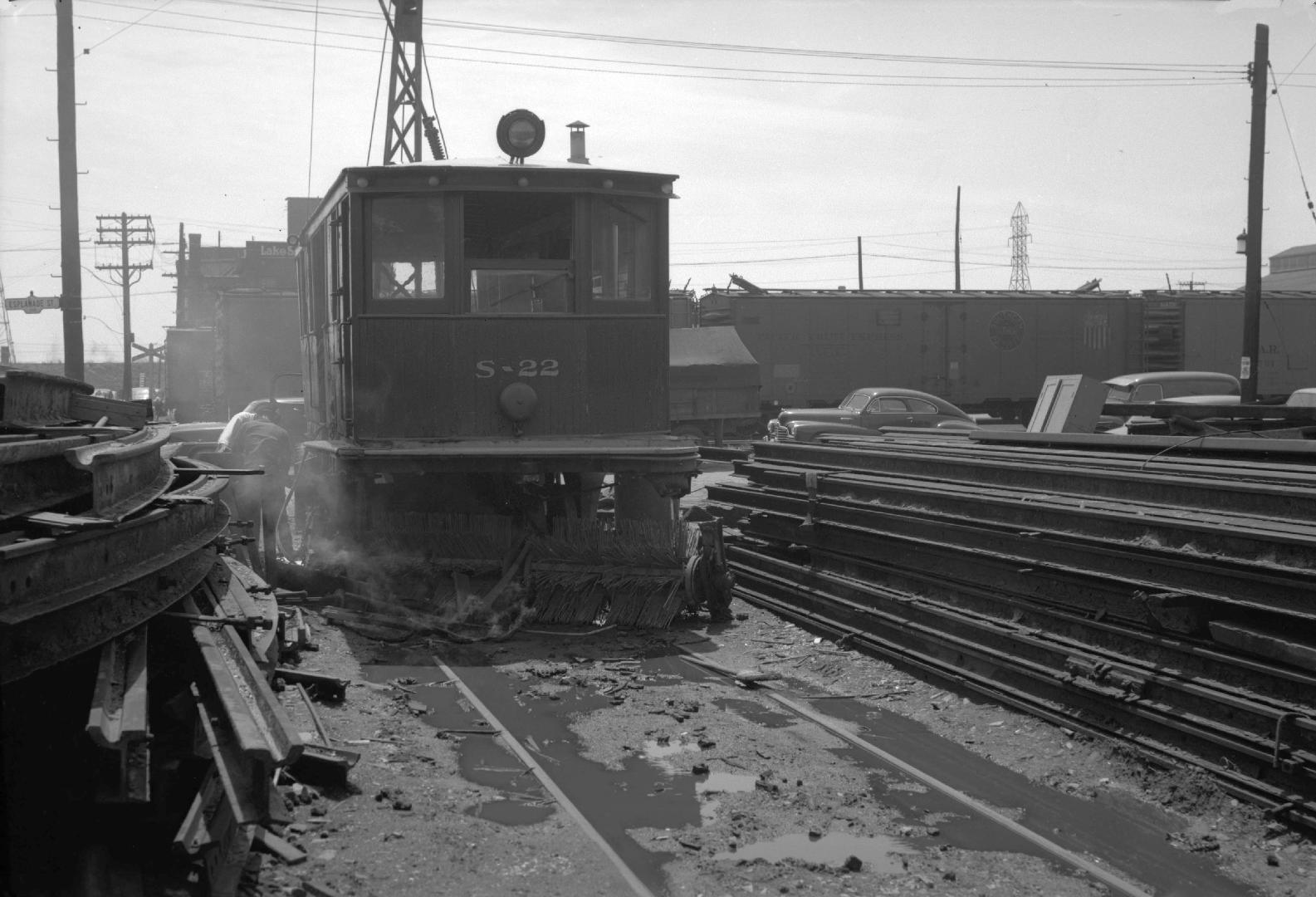 T.T.C., #S-22, sweeper, being scrapped at George St. yard, looking south across Esplanade E