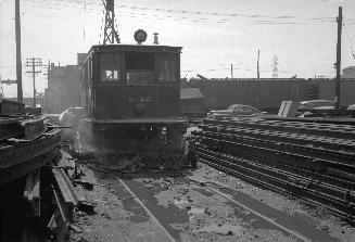 T.T.C., #S-22, sweeper, being scrapped at George St. yard, looking south across Esplanade E